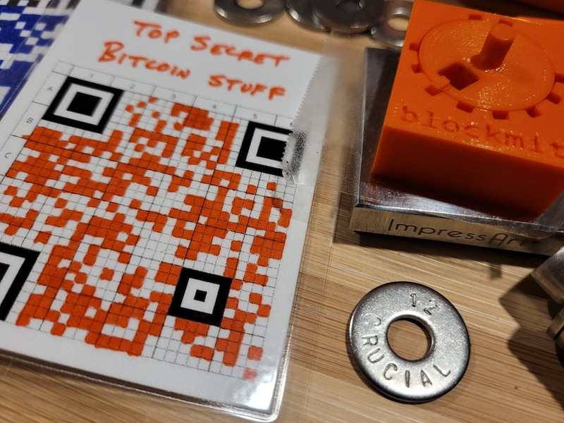 Photo of hand-transcribed 25x25 SeedQR code on paper